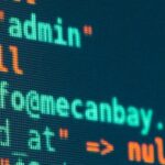 Vibrant close-up of code displayed on a monitor with various programming details.